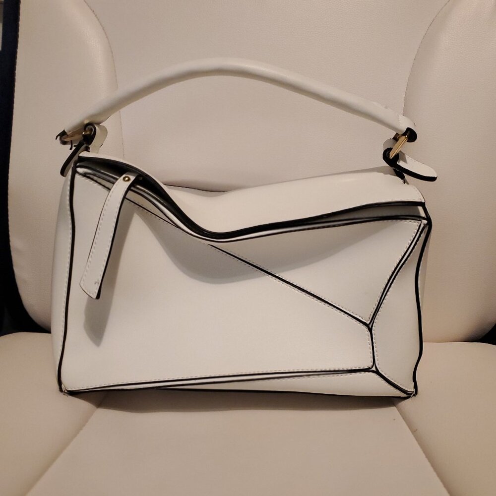 White puzzle bag
